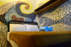 Postel nebo postele na pokoji v ubytování Pondok IJo Guesthouse