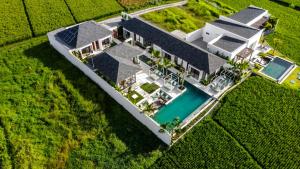 an aerial view of a house with a swimming pool at Villa Nature View by BaliSuperHost in Ubud