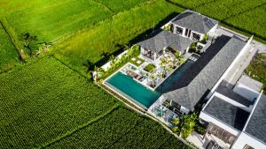 an overhead view of a house with a swimming pool at Villa Nature View by BaliSuperHost in Ubud