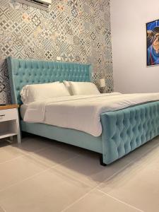 Rúm í herbergi á Hotel Mono Azul