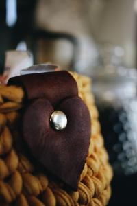 a heart shaped cake with a pearl on top at The Wild Edge Last Light Cottage in Knysna