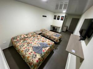 Letto o letti in una camera di Vivienda turística Arboleda de Cádiz