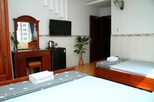 Postel nebo postele na pokoji v ubytování HOTEL NGUYEN ANH