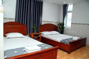Postel nebo postele na pokoji v ubytování HOTEL NGUYEN ANH