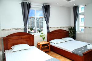 Postel nebo postele na pokoji v ubytování HOTEL NGUYEN ANH