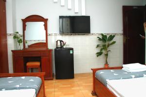 Postel nebo postele na pokoji v ubytování HOTEL NGUYEN ANH