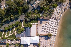 an aerial view of a resort with a row of umbrellas at Beach 222 Oludeniz in Fethiye