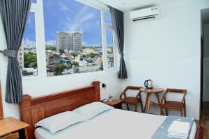 Postel nebo postele na pokoji v ubytování HOTEL NGUYEN ANH