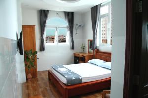 Postel nebo postele na pokoji v ubytování HOTEL NGUYEN ANH
