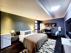 Ένα ή περισσότερα κρεβάτια σε δωμάτιο στο JS Boutique Hotel