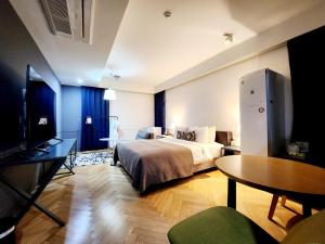 Ένα ή περισσότερα κρεβάτια σε δωμάτιο στο JS Boutique Hotel