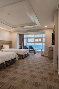 Postel nebo postele na pokoji v ubytování Cocoon Hotel