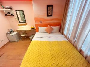 Postel nebo postele na pokoji v ubytování Tz Shin Resort Hostel