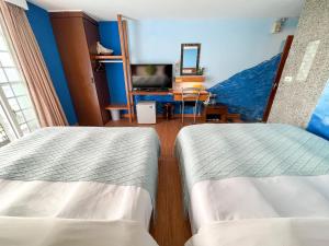Postel nebo postele na pokoji v ubytování Tz Shin Resort Hostel