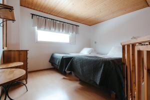 Postel nebo postele na pokoji v ubytování Lapland Hotels Sirkantähti