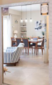 a dining room with a table and chairs at Amazing Modern Apartment with Sea View in Athens