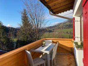 a patio with a table and chairs on a balcony at Wohnung Steixner in Westendorf