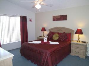 a bedroom with a bed with a stuffed animal on it at 4 Bedroom Value Plus Home with Private Pool in Orlando
