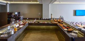 a buffet line with many different types of food at Le Palace Hotel in Thessaloniki