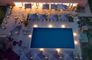 an overhead view of a swimming pool at night at Mount Venturi - Aix-En-Provence Sainte-Victoire - Bar & Restaurant & Padel in Rousset