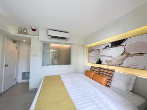Ένα ή περισσότερα κρεβάτια σε δωμάτιο στο Bellagio Pets Friendly Resort