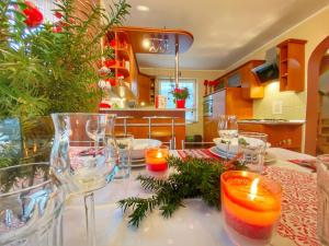 a dining room table with candles and wine glasses at Dom u Gazdy przy Gondoli in Szczyrk