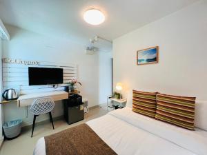 Letto o letti in una camera di Bayshore Inn