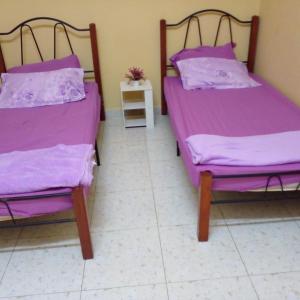 Cama ou camas em um quarto em HOMESTAY KAKMAH