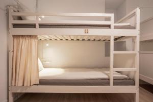 Postel nebo postele na pokoji v ubytování Ruifang Yi Hostel