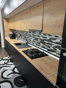 Köök või kööginurk majutusasutuses Apartament lux zona stadion ion oblemenco