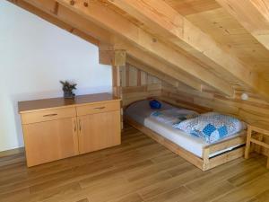 a bedroom with a bed in the attic at Obereggen - Anna in Eggen