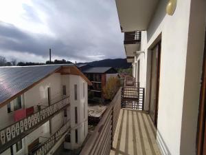 a balcony of a building with a view of a mountain at Bakuriani apartament in Bakuriani