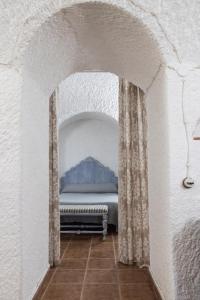 Łóżko lub łóżka w pokoju w obiekcie Casa Cueva Picoesquina