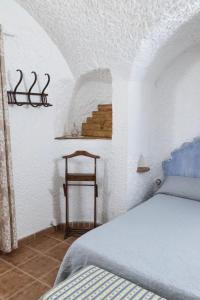 Łóżko lub łóżka w pokoju w obiekcie Casa Cueva Picoesquina