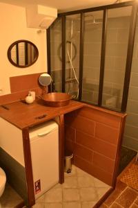 a small bathroom with a sink and a toilet at Gîte 'An Kay Ou' - L'Aiglette in Pontaix