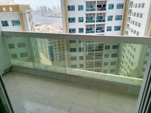 a view from a balcony in a building at شقة غرفتين وصاله ابراج الؤلؤه in Ajman 