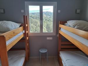 Posteľ alebo postele v izbe v ubytovaní Villa de charme avec piscine entre Ajaccio et Porticcio