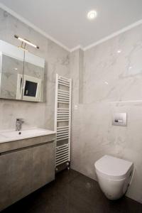 a bathroom with a toilet and a sink at Castle of Beauty in Thessaloniki in Thessaloniki