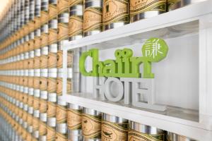 a shelf in a china hot store with a sign on it at Chaiin Hotel - Dongmen in Taipei
