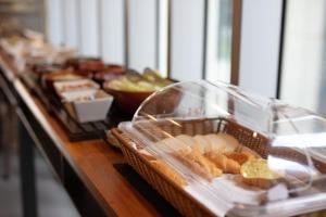 a buffet of bread and pastries on a table at Chaiin Hotel - Dongmen in Taipei