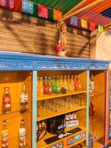 a shelf filled with lots of bottles of alcohol at Palacio de Aviles Affiliated By Melia in Avilés