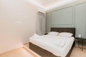 Posteľ alebo postele v izbe v ubytovaní Satus Finem Egnatia's Luxury Apartment