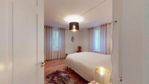 Postel nebo postele na pokoji v ubytování Abitaziun Chavallera - St Moritz