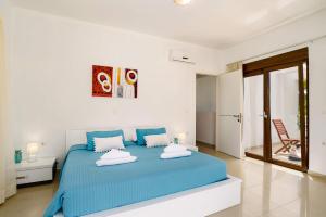 Giường trong phòng chung tại Villa Persis by Villa Plus +15 ảnh