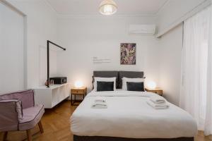 Ένα ή περισσότερα κρεβάτια σε δωμάτιο στο Lycabettus Residence