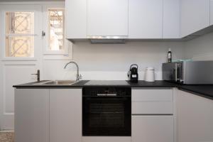 A kitchen or kitchenette at Lycabettus Residence