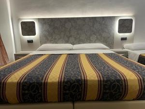 Postel nebo postele na pokoji v ubytování Hotel principe