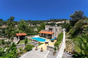 an aerial view of a villa with a swimming pool at Villa Katia Faragi by Villa Plus in Giannoudi