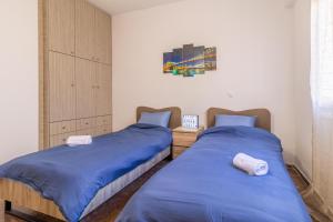 Ένα ή περισσότερα κρεβάτια σε δωμάτιο στο Korinthos Downtown Apartment
