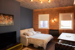 Caju Deluxe Apartment tesisinde bir odada yatak veya yataklar